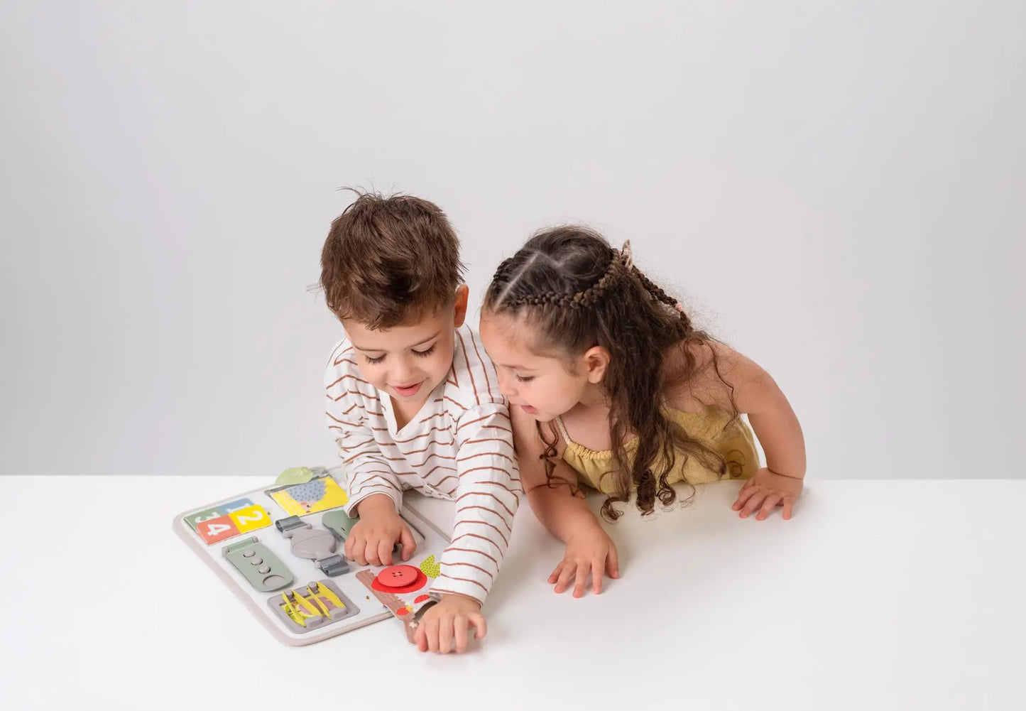 Taf toys – activity buckles board